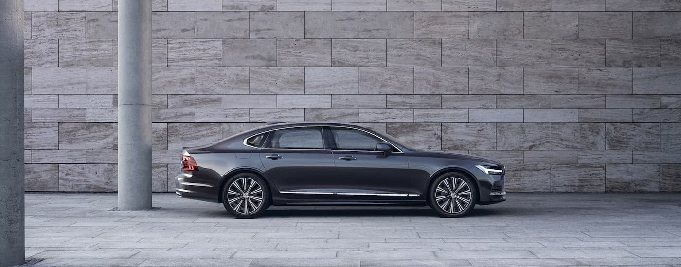 A gray 2025 Volvo S90 Hybrid is shown parked near a Volvo dealer near Rutland.