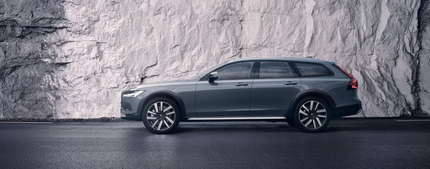 A side angle view of a dark grey 2024 Volvo V90 Cross Country.