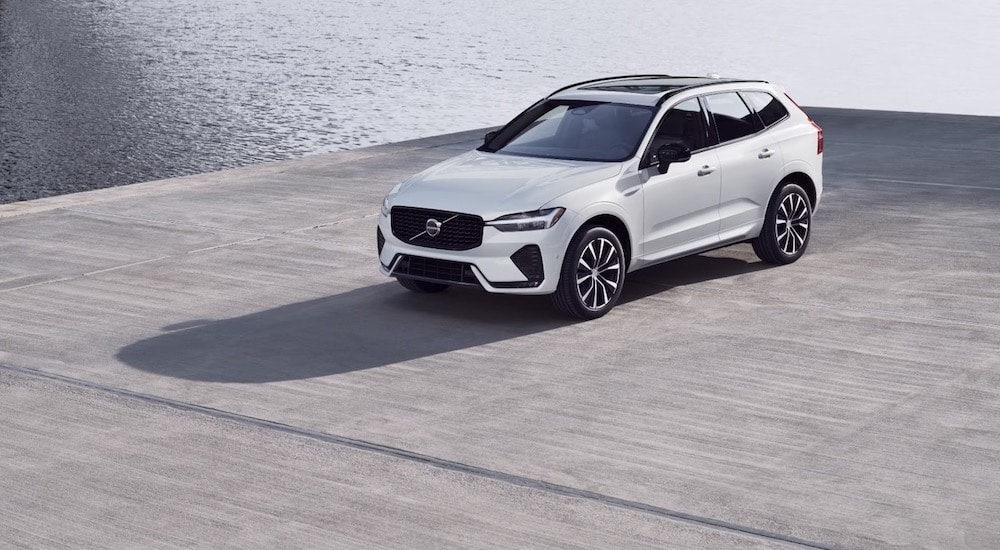 A white 2024 Volvo XC60 for sale is shown from the front at an angle.