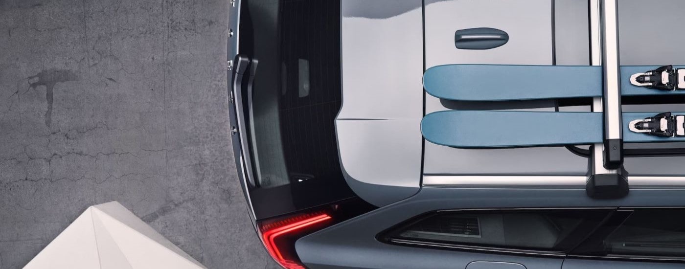 Skis are shown on the roof of grey 2023 Volvo V90 Cross Country.