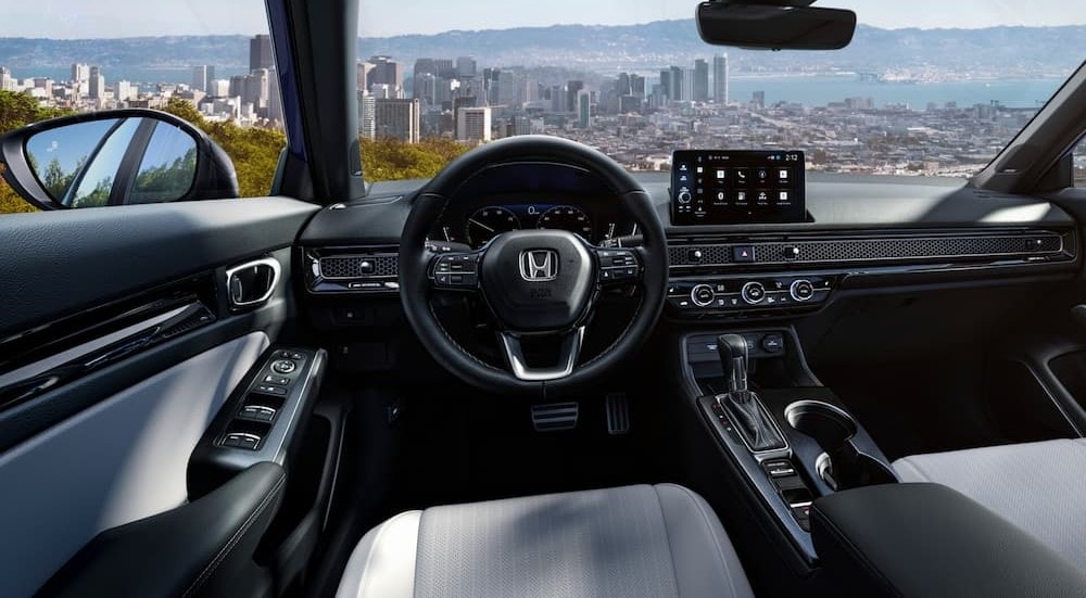 Honda%20Civic%20for%20sale%20-%202025%20Honda%20Civic%20-Cockpit.jpg The black and gray interior and dash are shown in a 2025 Honda Civic for sale.