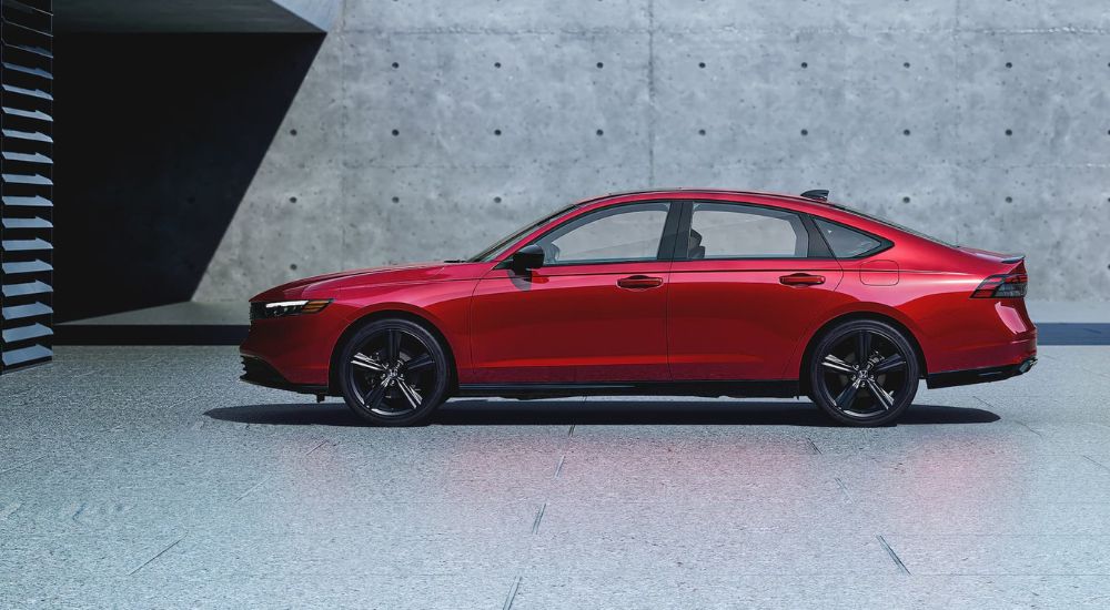 Side angle view of a red 2024 Honda Accord.