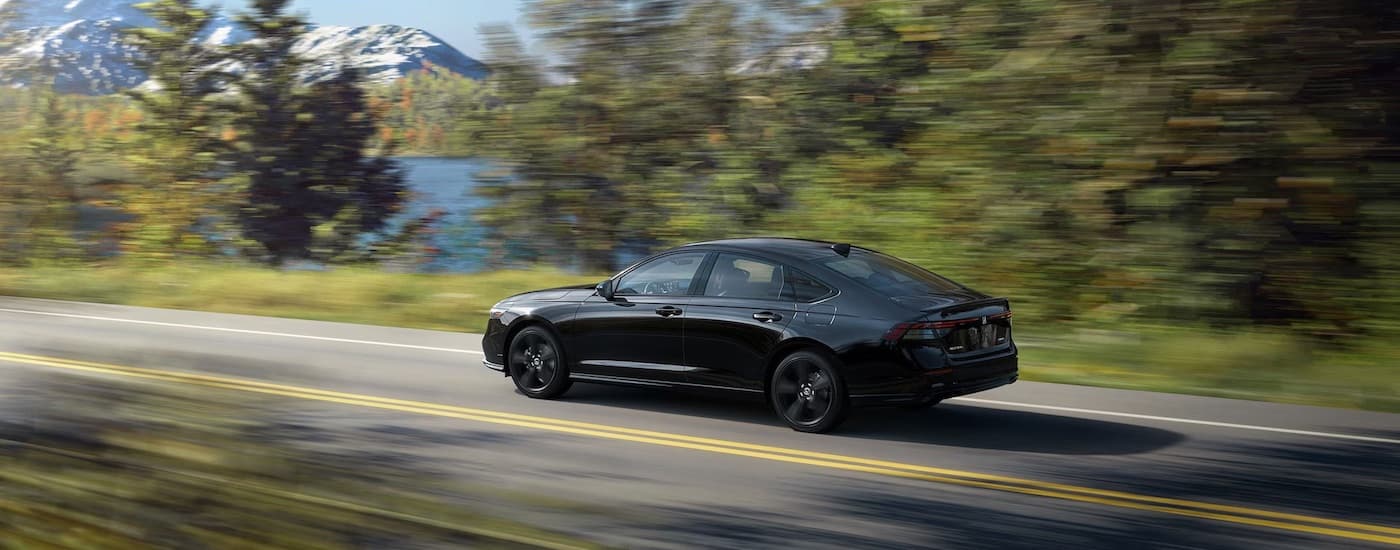 A black 2024 Honda Accord for sale is shown from the side.