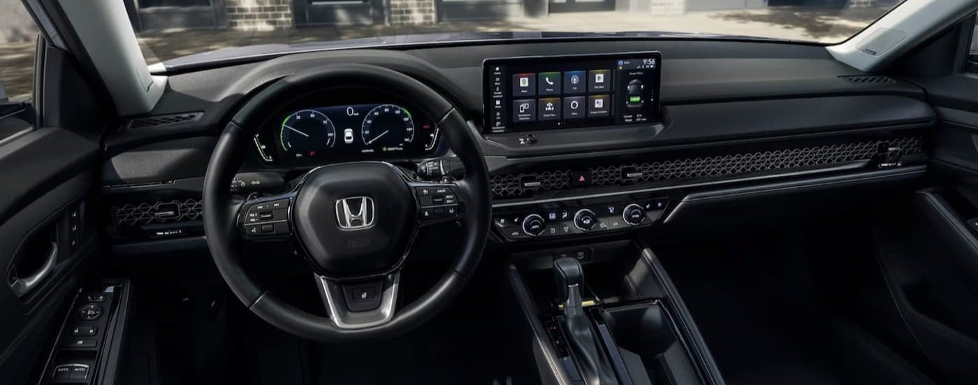 The black interior and dash are shown in a 2025 Honda Accord Hybrid for sale.