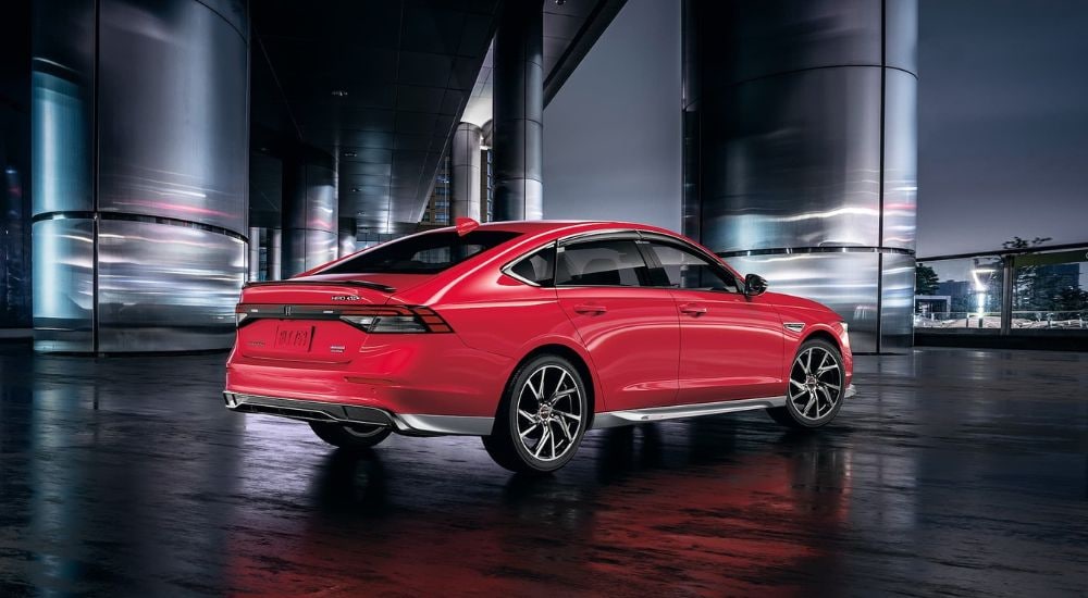 2024%20Honda%20Accord%20HPD%20-%20Rear%202.jpg A rear view of a red 2024 Honda Accord HPD parked outside a building.