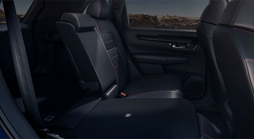 The black interior seating in a blue 2025 Honda CR-V Sport Touring Hybrid.