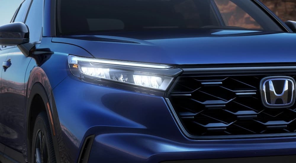  Close-up of a headlight on a 2025 Honda CR-V Sport Touring Hybrid for sale in Cheshire.