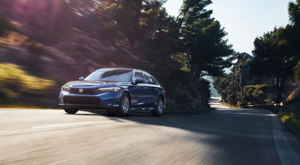 Honda%20Civic%20for%20sale%20-%202025%20Honda%20Civic%20-%20Blue.jpg A blue 2025 Honda Civic is shown driving on a back road.