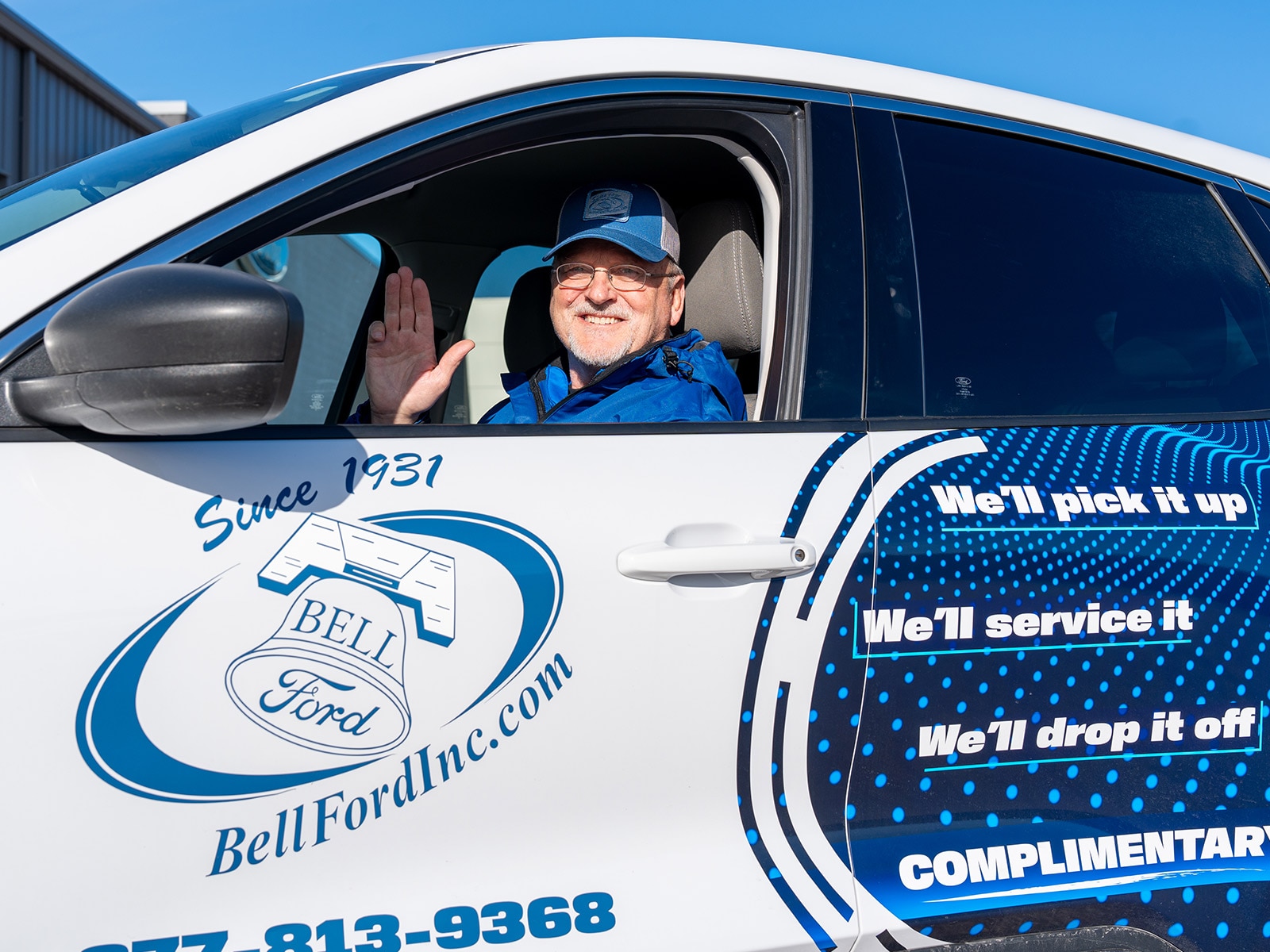 Bell Ford PDEL pickup and delivery driver with service vehicle in Arlington, Wisconsin
