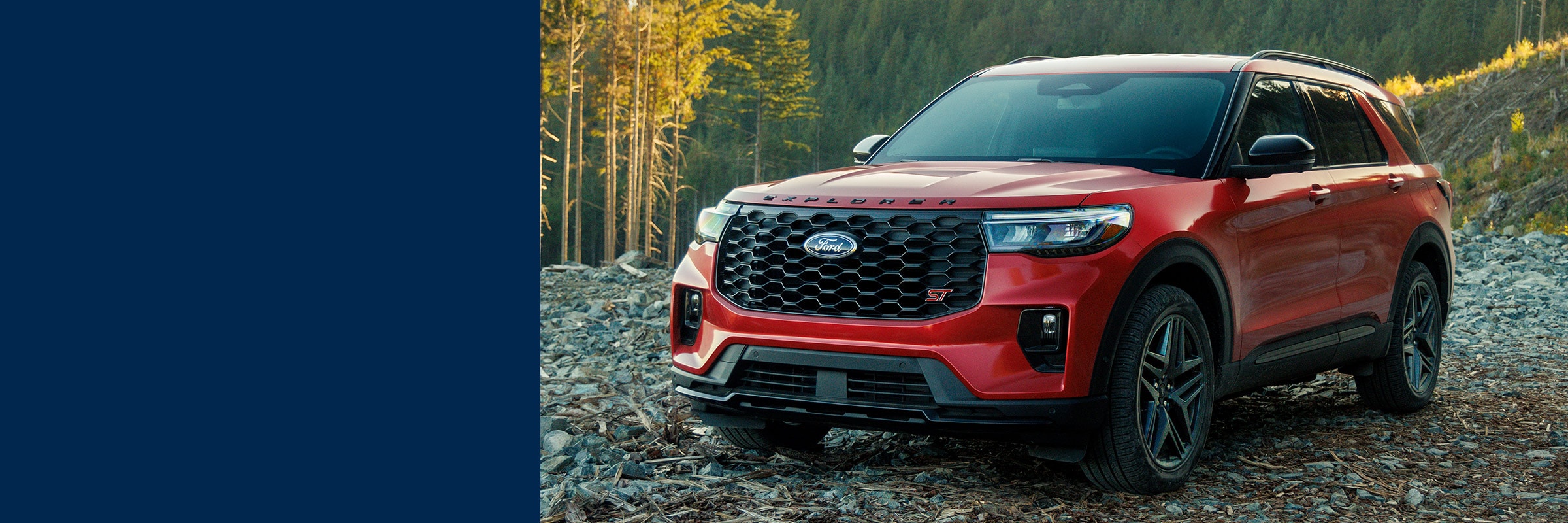 Red 2026 Ford Explorer ST on a mountain trail. $4,000 Total Cash on the 2026 Ford Explorer at Bell Ford in Arlington, Wisconsin.