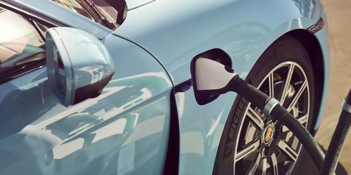 Porsche Taycan plugged into a charging station