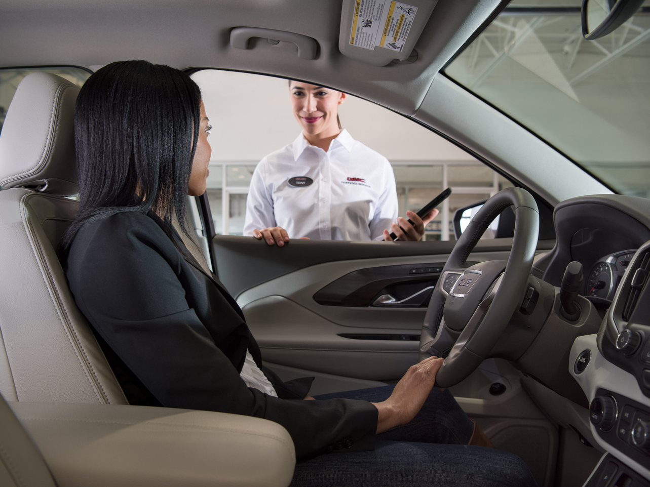 GMC dealer helping a client