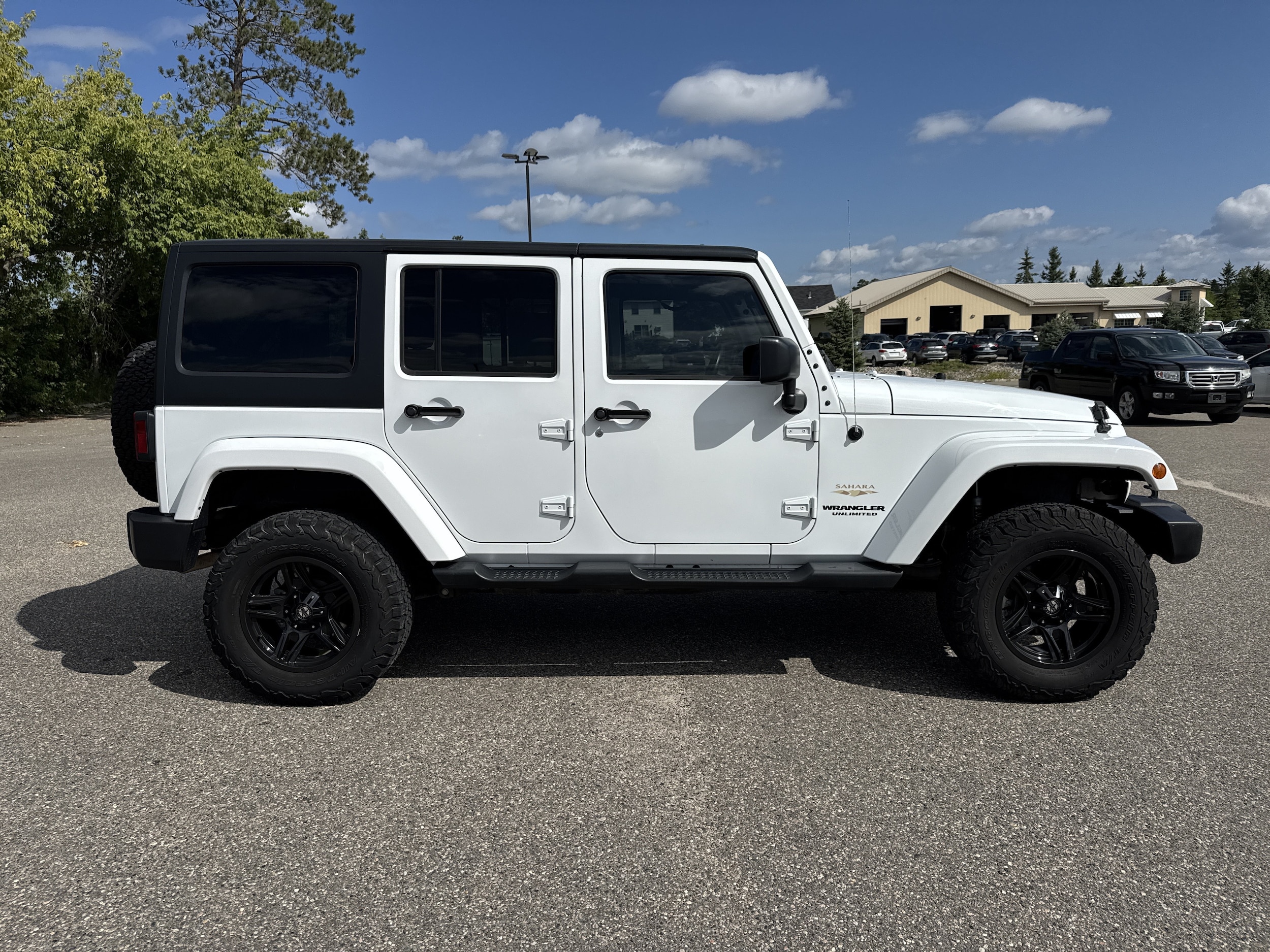 Used 2015 Jeep Wrangler Unlimited Sahara with VIN 1C4BJWEG8FL668635 for sale in Bemidji, Minnesota