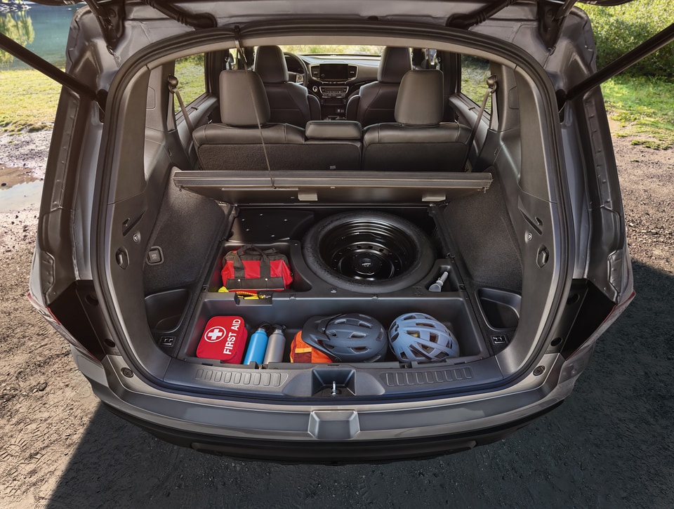 gray Honda Passport SUV with the large trunk open