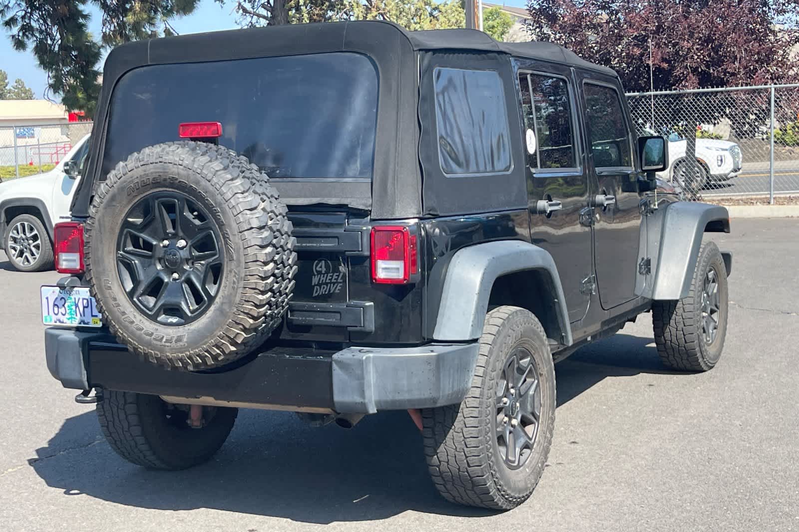 Used 2014 Jeep Wrangler Unlimited Sport with VIN 1C4BJWDGXEL309528 for sale in Bend, OR