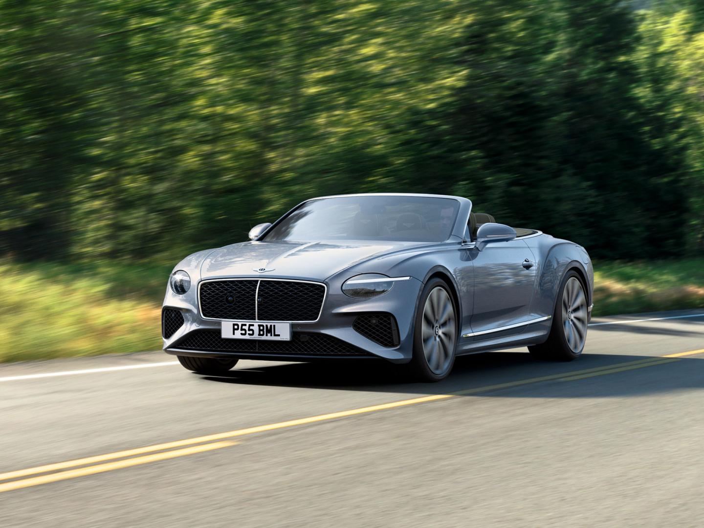 2025 Bentley Continental GT Convertible silver cruising.