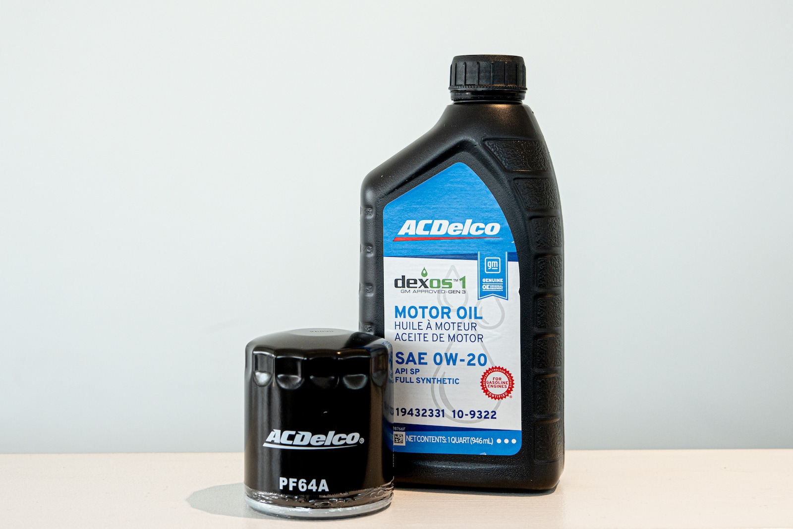 Technician checking engine oil dipstick