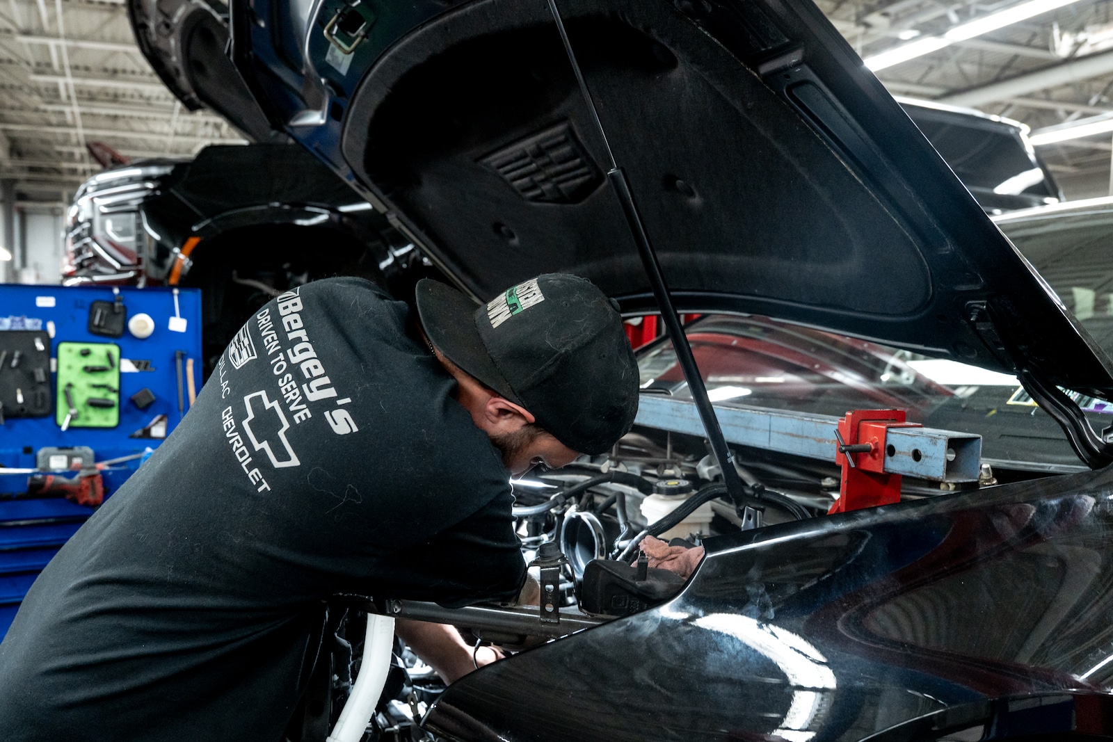Technician performing additional vehicle inspection