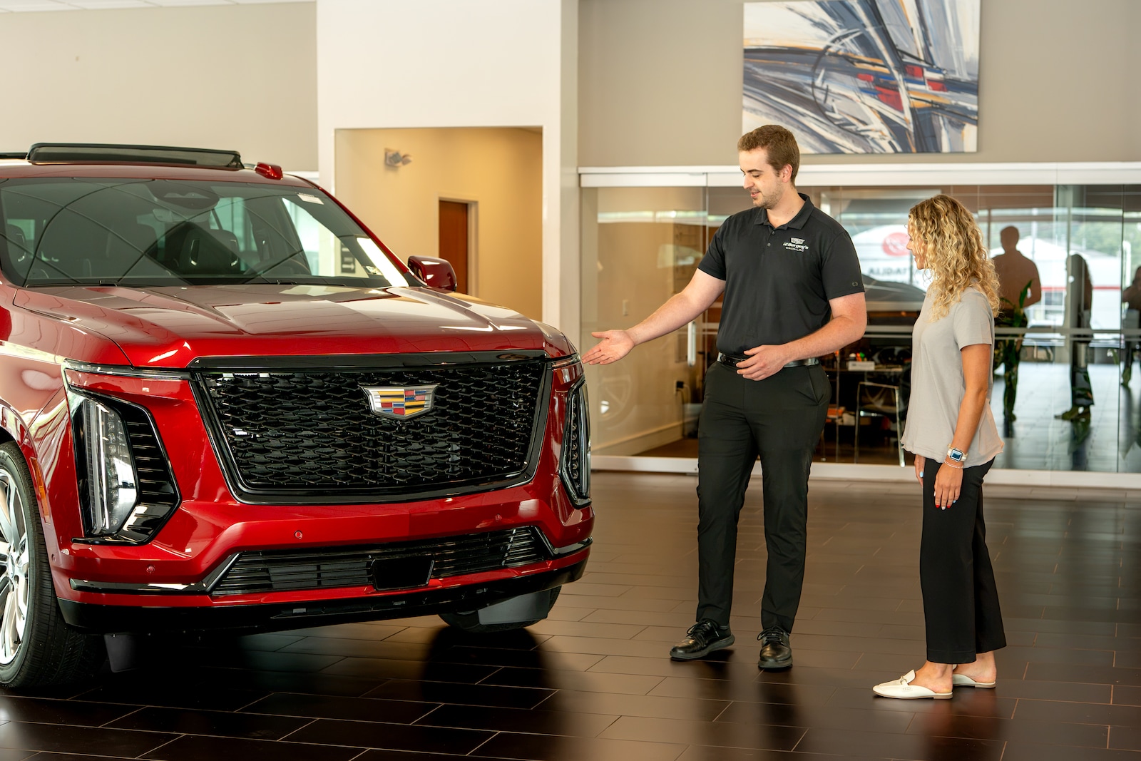 A Bergey's Cadillac sales consultant with a customer