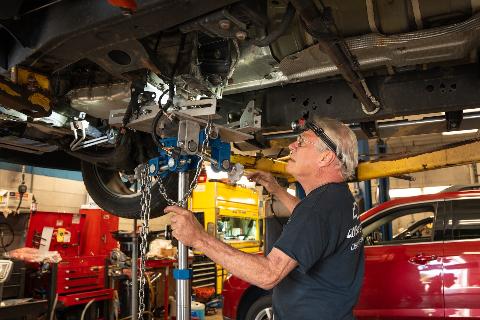 Technician performing additional vehicle inspection