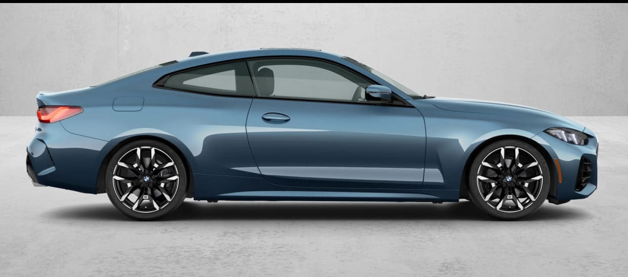 Blue BMW 430i Coupe shown in full side profile.