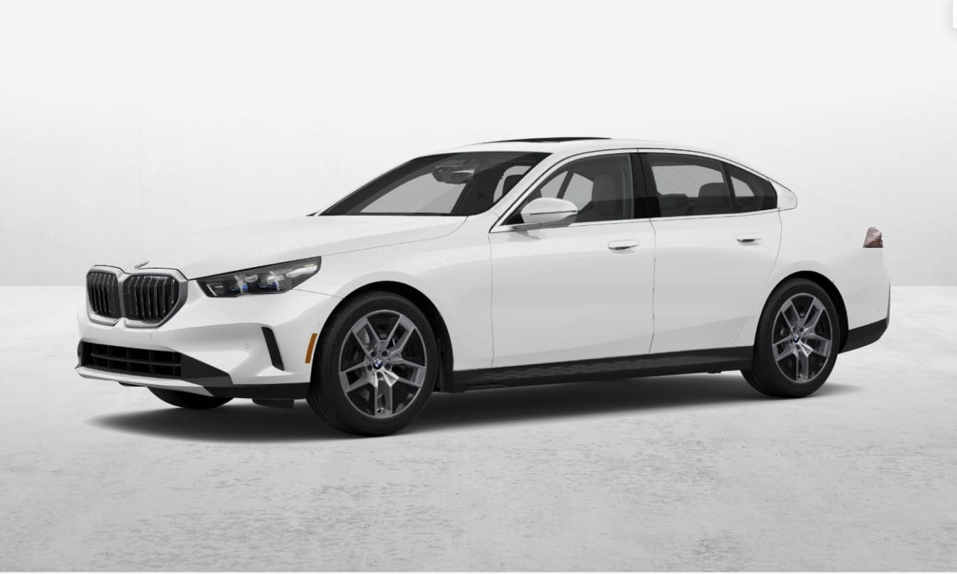 White BMW 5 Series sedan shown from a front three-quarter angle against a clean studio background.