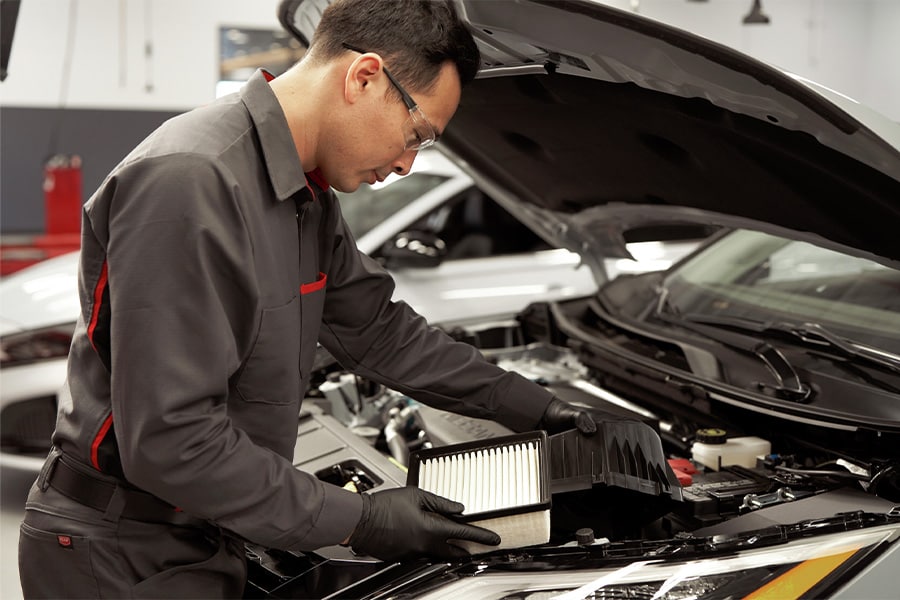 Service Technician replacing Air Filter