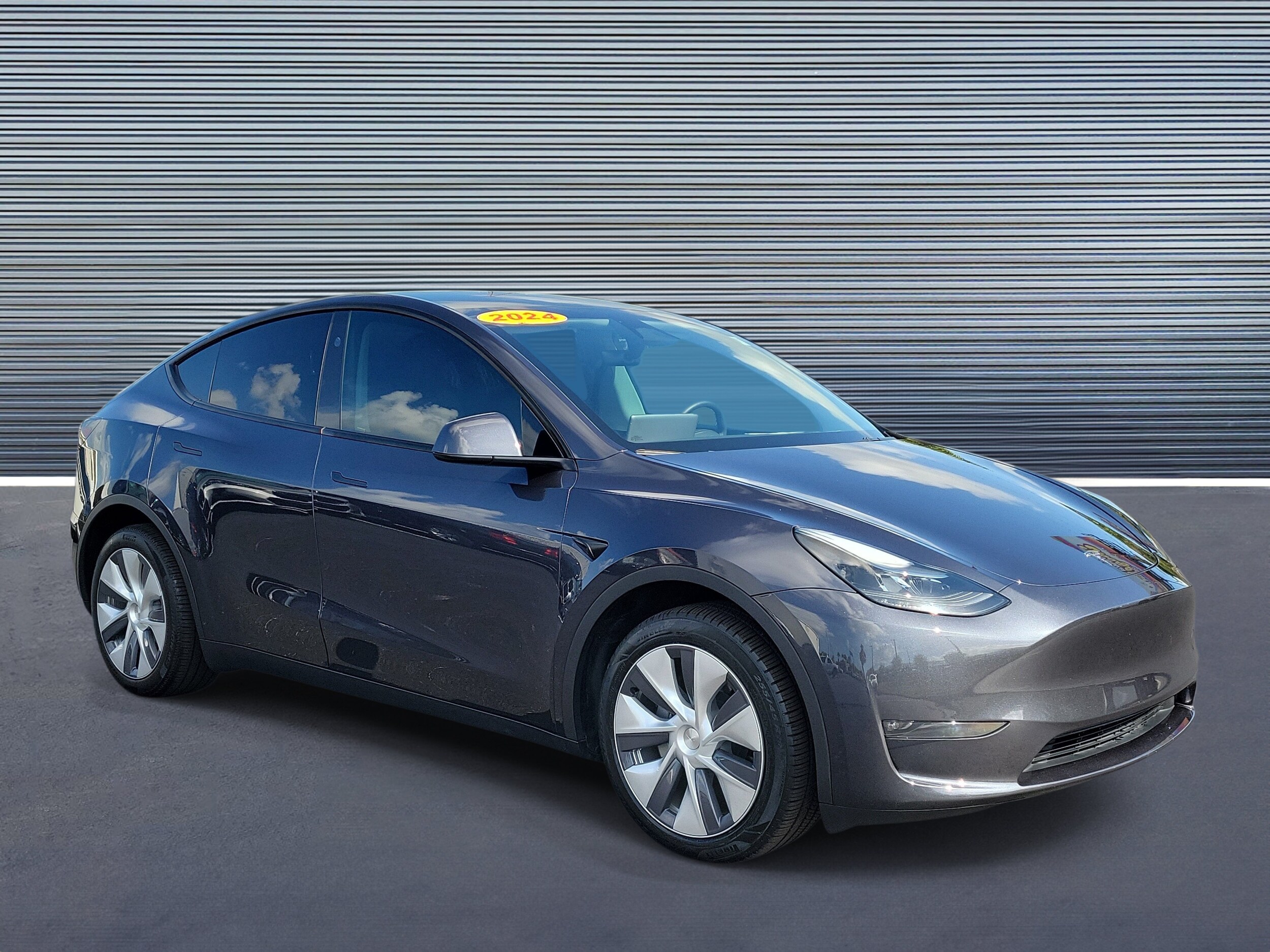 Used 2024 Tesla Model Y Long Range with VIN 7SAYGDEE7RA262610 for sale in St. Petersburg, FL