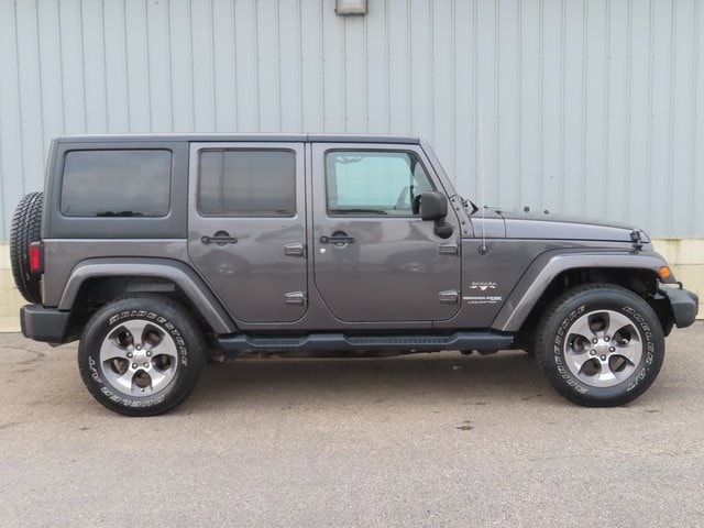 Used 2018 Jeep Wrangler Unlimited Sahara with VIN 1C4BJWEG3JL810446 for sale in Cadillac, MI