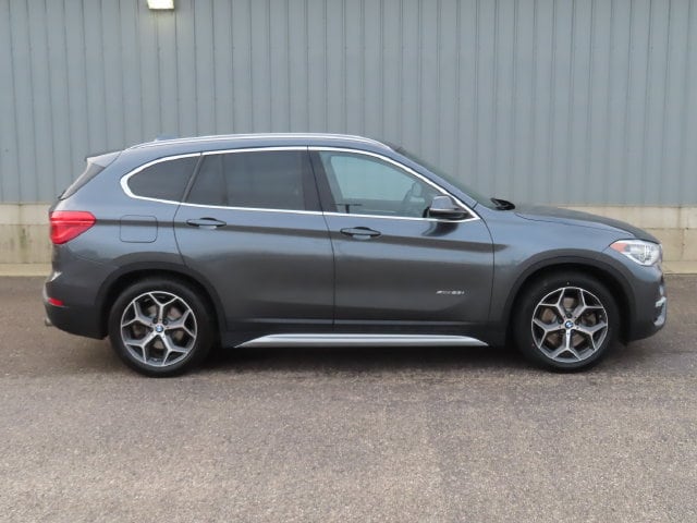 Used 2016 BMW X1 28i with VIN WBXHT3C30GP883006 for sale in Cadillac, MI
