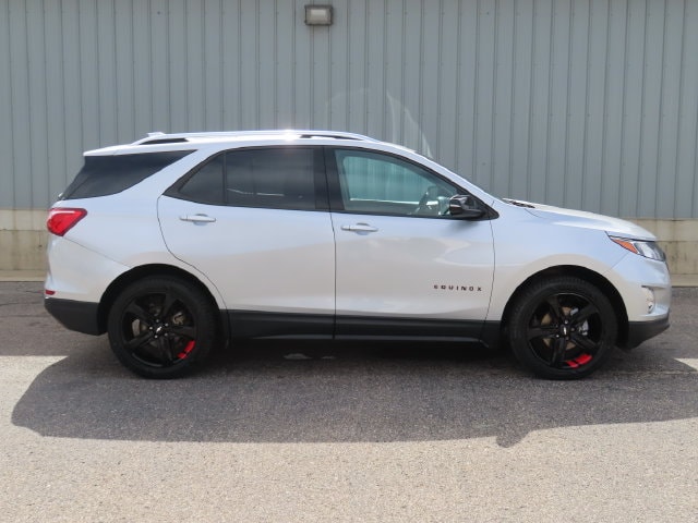 Used 2021 Chevrolet Equinox Premier with VIN 2GNAXXEVXM6153289 for sale in Cadillac, MI