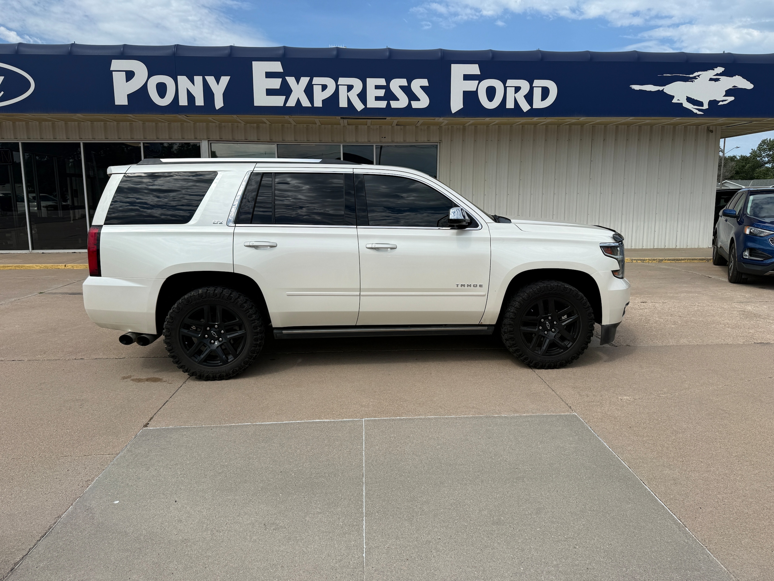 Used 2015 Chevrolet Tahoe LTZ with VIN 1GNSKCKC9FR220552 for sale in Minden, NE