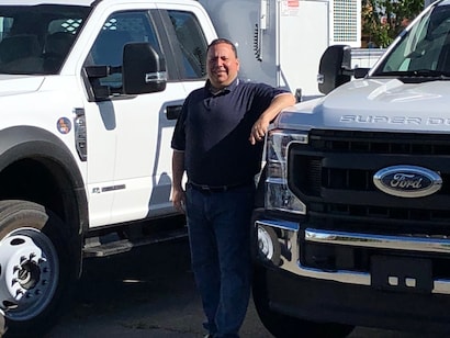 Mark Wexler with a couple of finished Scelzi upfits.