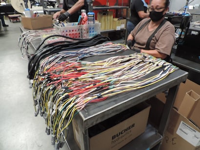 All that equipment needs custom wire harnesses built right here.
