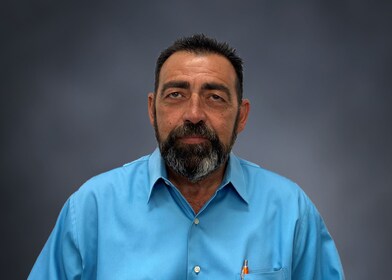 Staff member John Martins from ID_3e96fb986c47
