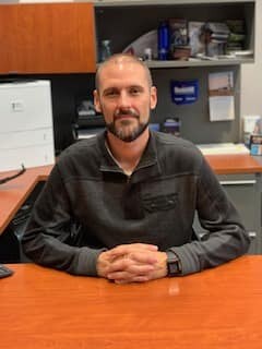 Staff member Eli Fisher from ID_69c6b7f8ad73