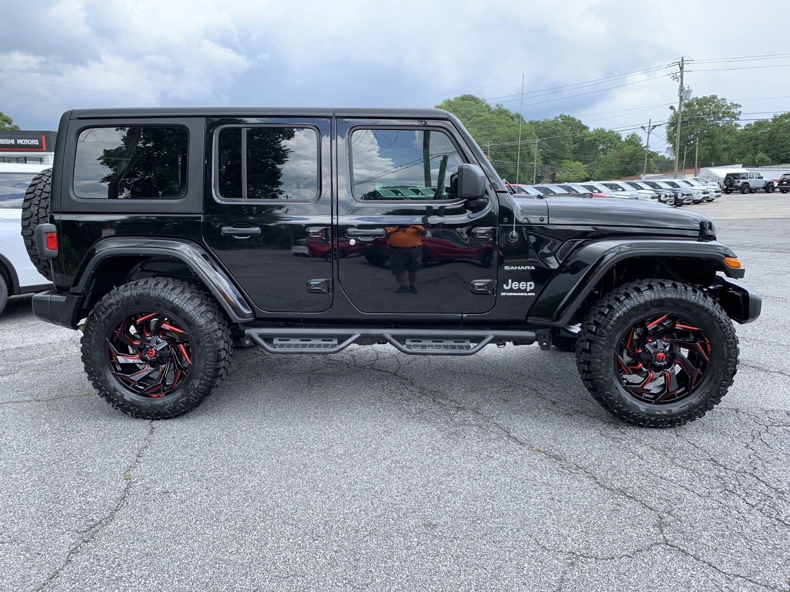 Used 2023 Jeep Wrangler 4-Door Sahara with VIN 1C4HJXEN5PW637938 for sale in Canton, GA