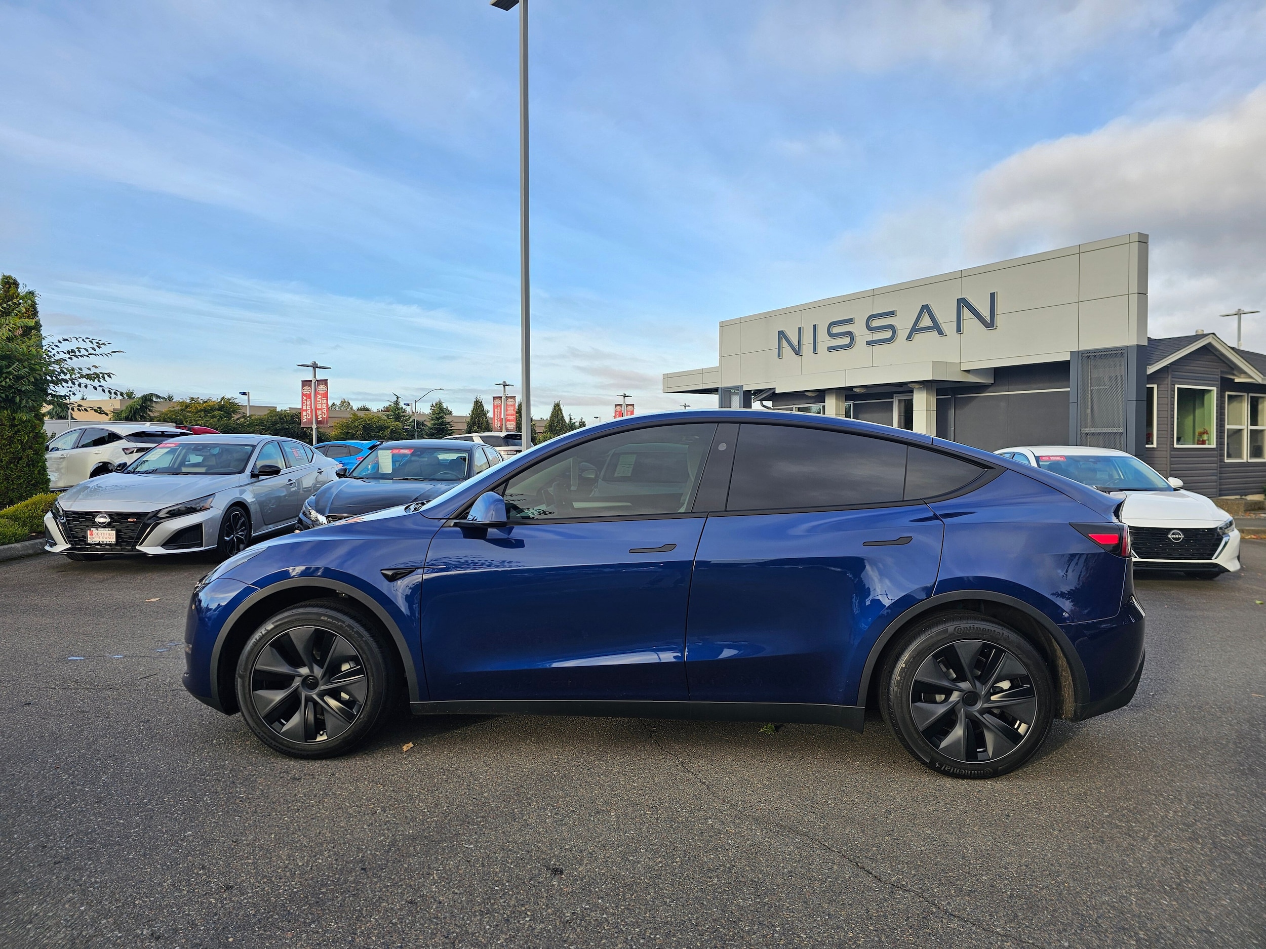 Used 2025 Tesla Model Y Long Range with VIN 7SAYGDED3SF263205 for sale in Puyallup, WA