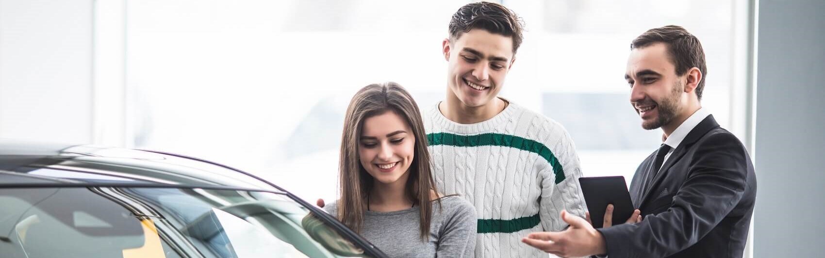 Young Couple Shopping for a Used Cehvrolet near Ogdensburg, NY