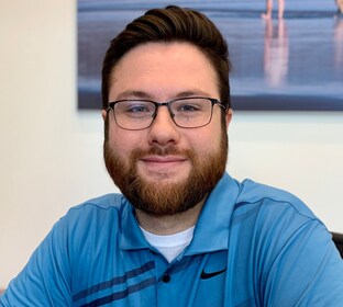 Staff member Ryan M from 7c708338130f