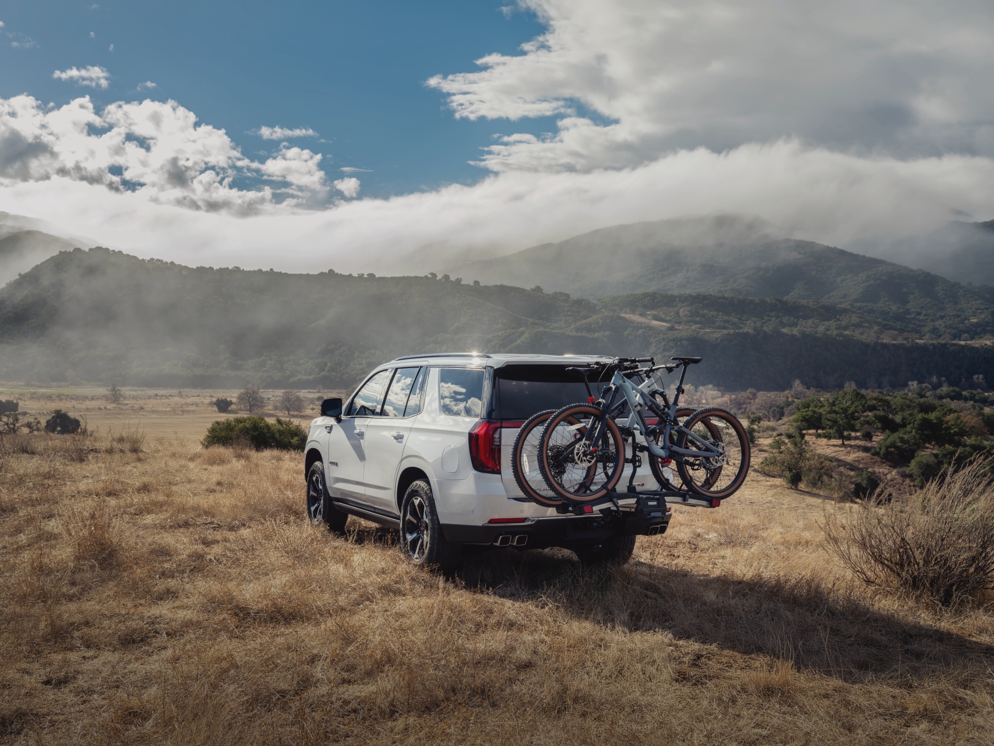 Exterior back of GMC Yukon carrying bicycles