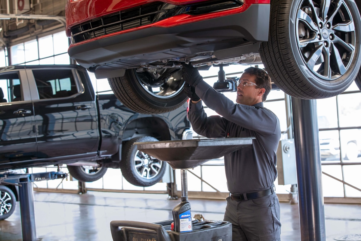 Chevrolet technician performing an oil change