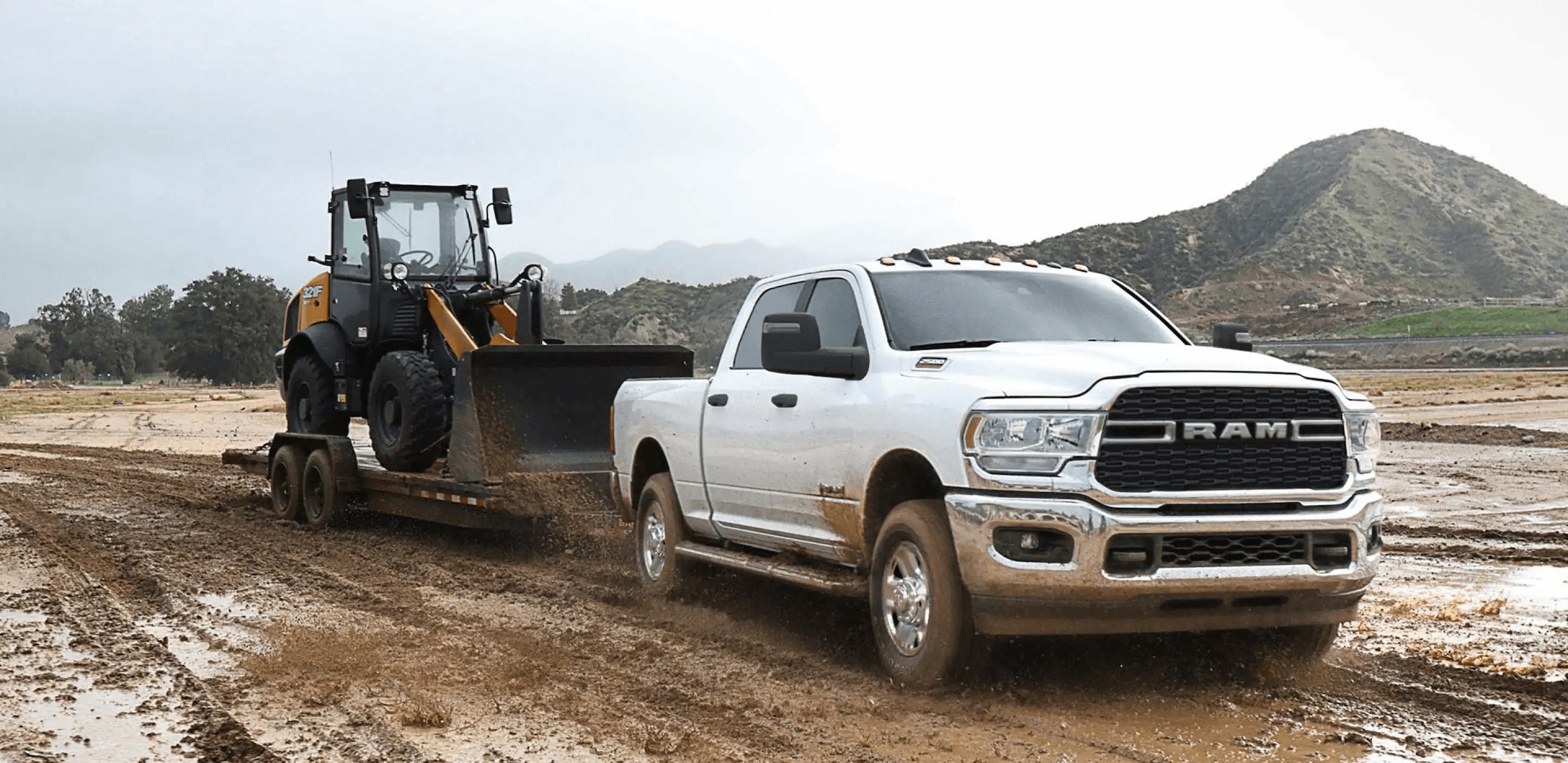 2023-ram-2500-towing dozer comp.png