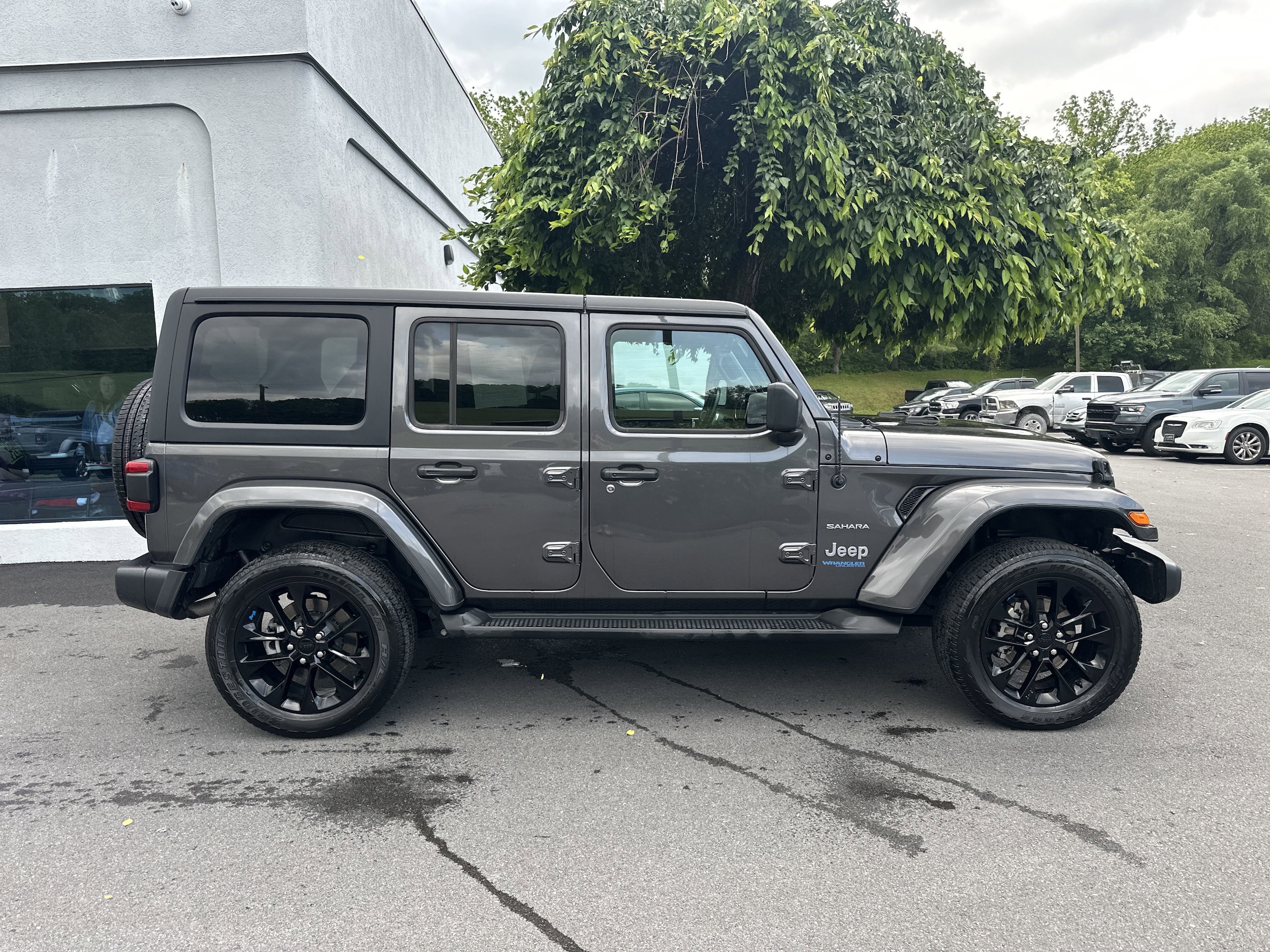 Used 2022 Jeep Wrangler Unlimited Sahara 4XE with VIN 1C4JJXP66NW281049 for sale in State College, PA
