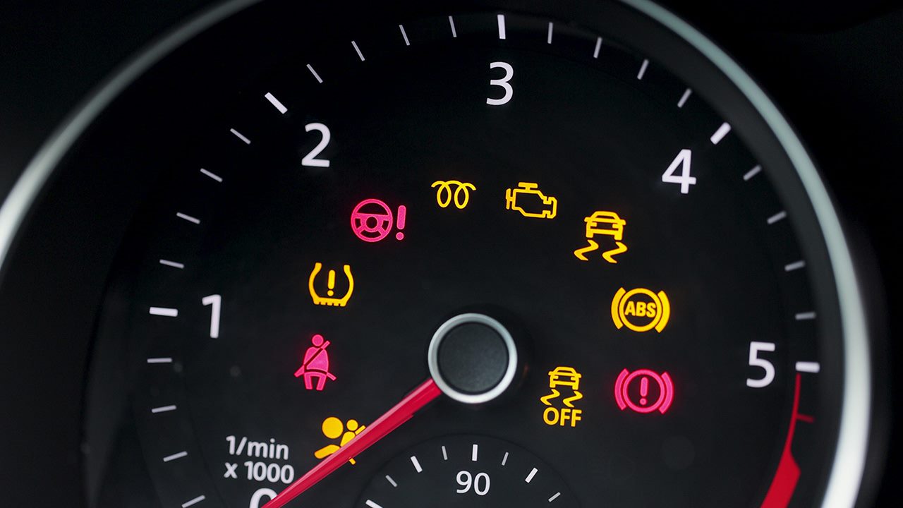 array of dashboar warning lights