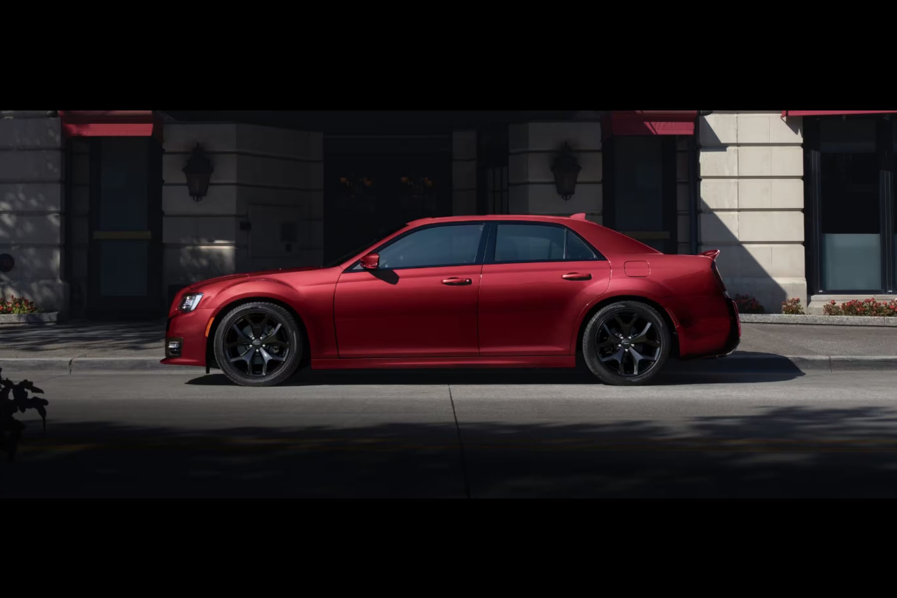 Red 2023 Chrysler 300 posed in profile