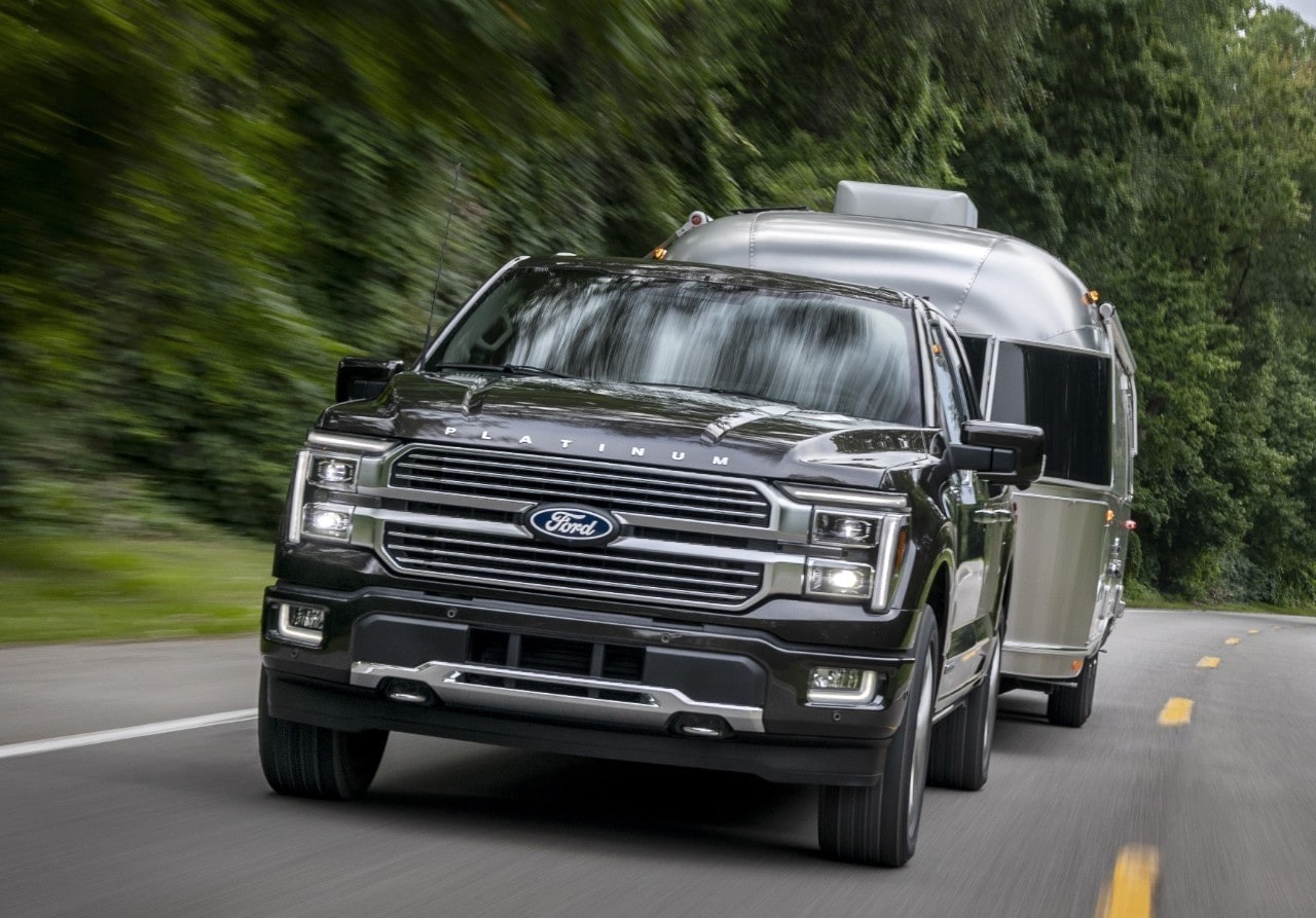 2025 Ford F-150 Platinum Hybrid towing a camper