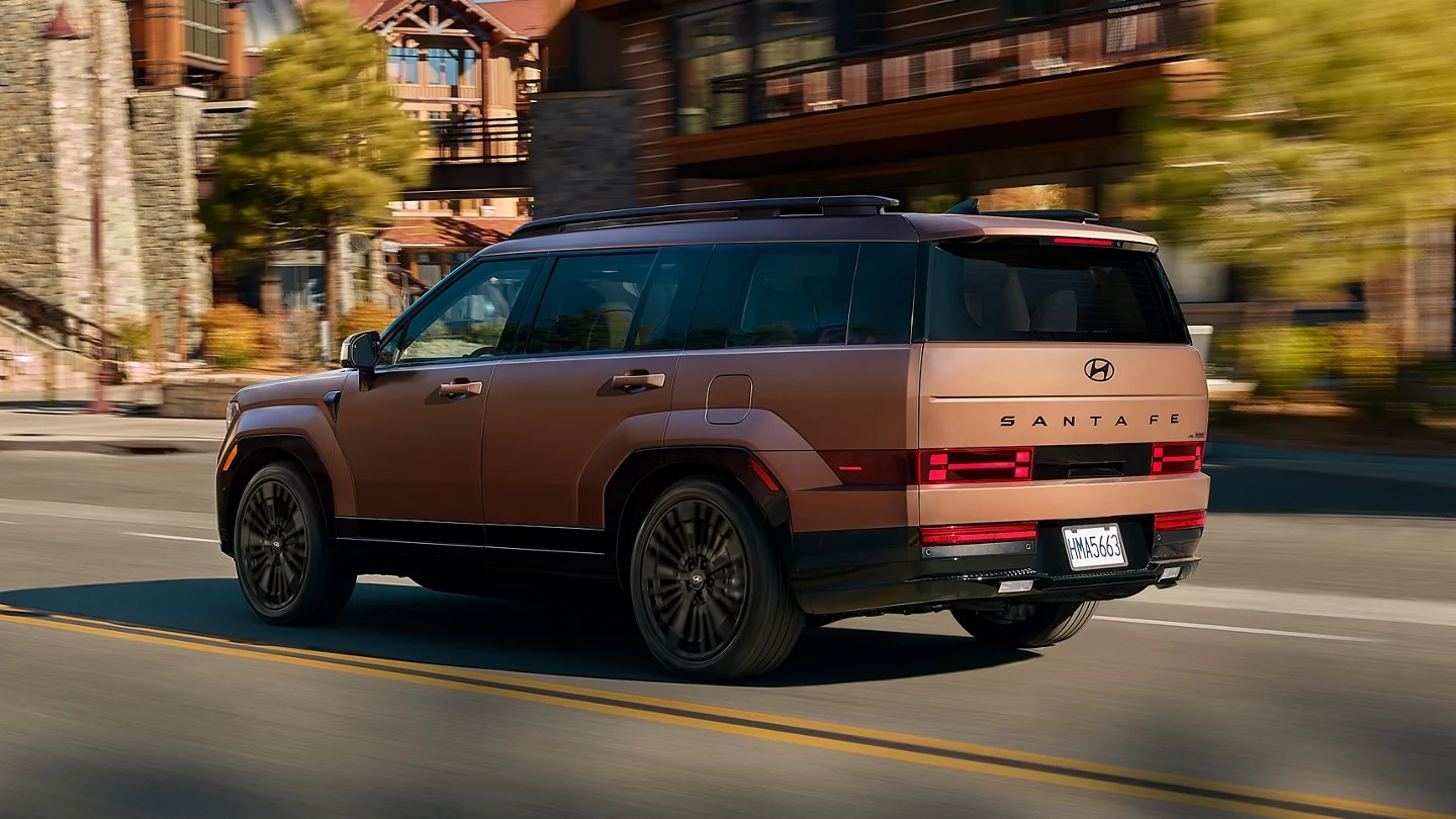 Copper 2027 Hyundai Santa Fe driving down the road
