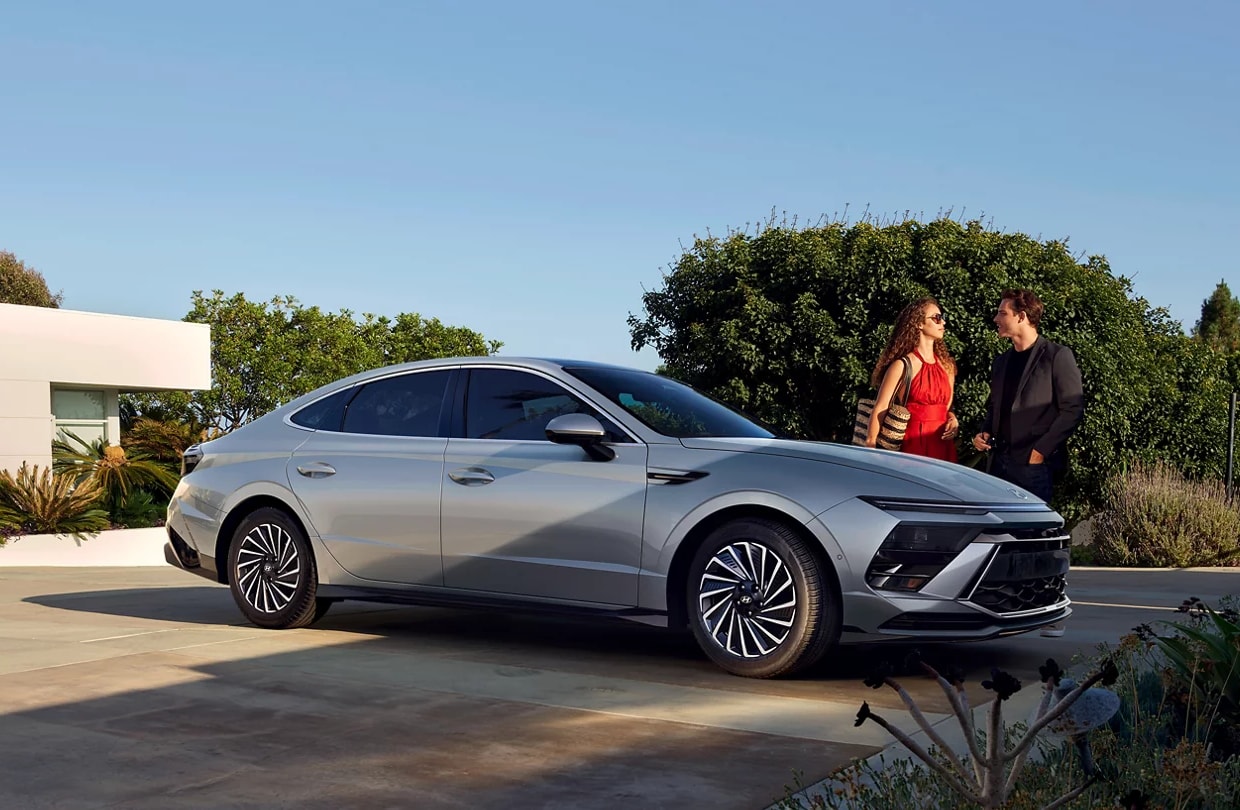 2024-hyundai-sonata-parked-w-couple.png