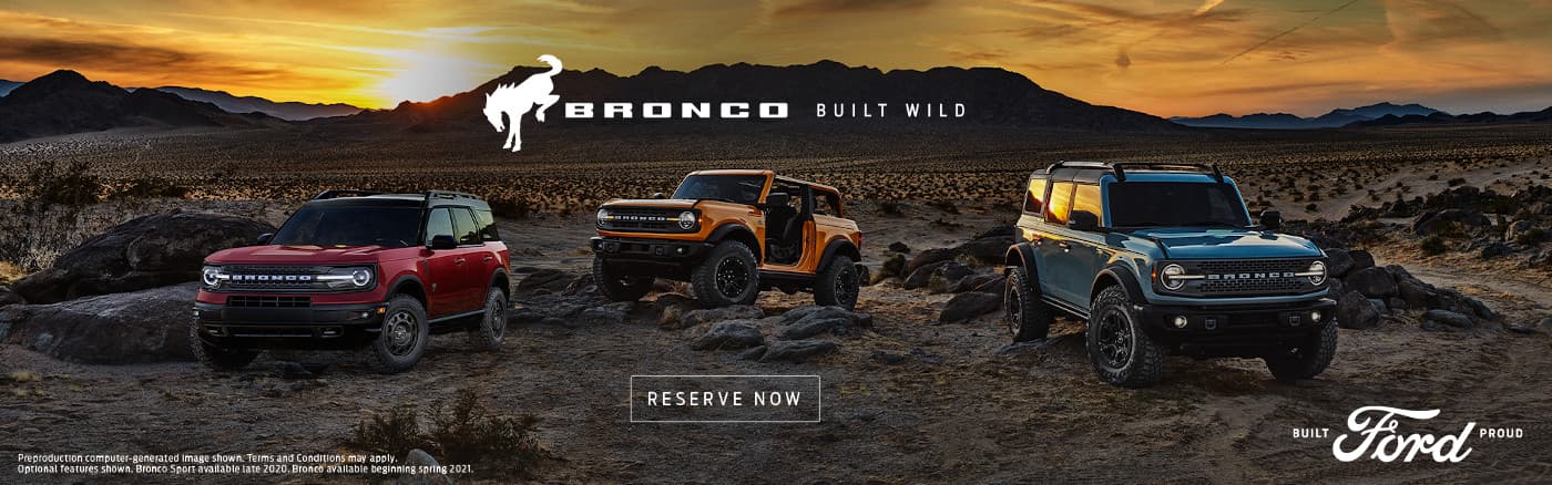 2021 Ford Broncos parked in front of a sunset